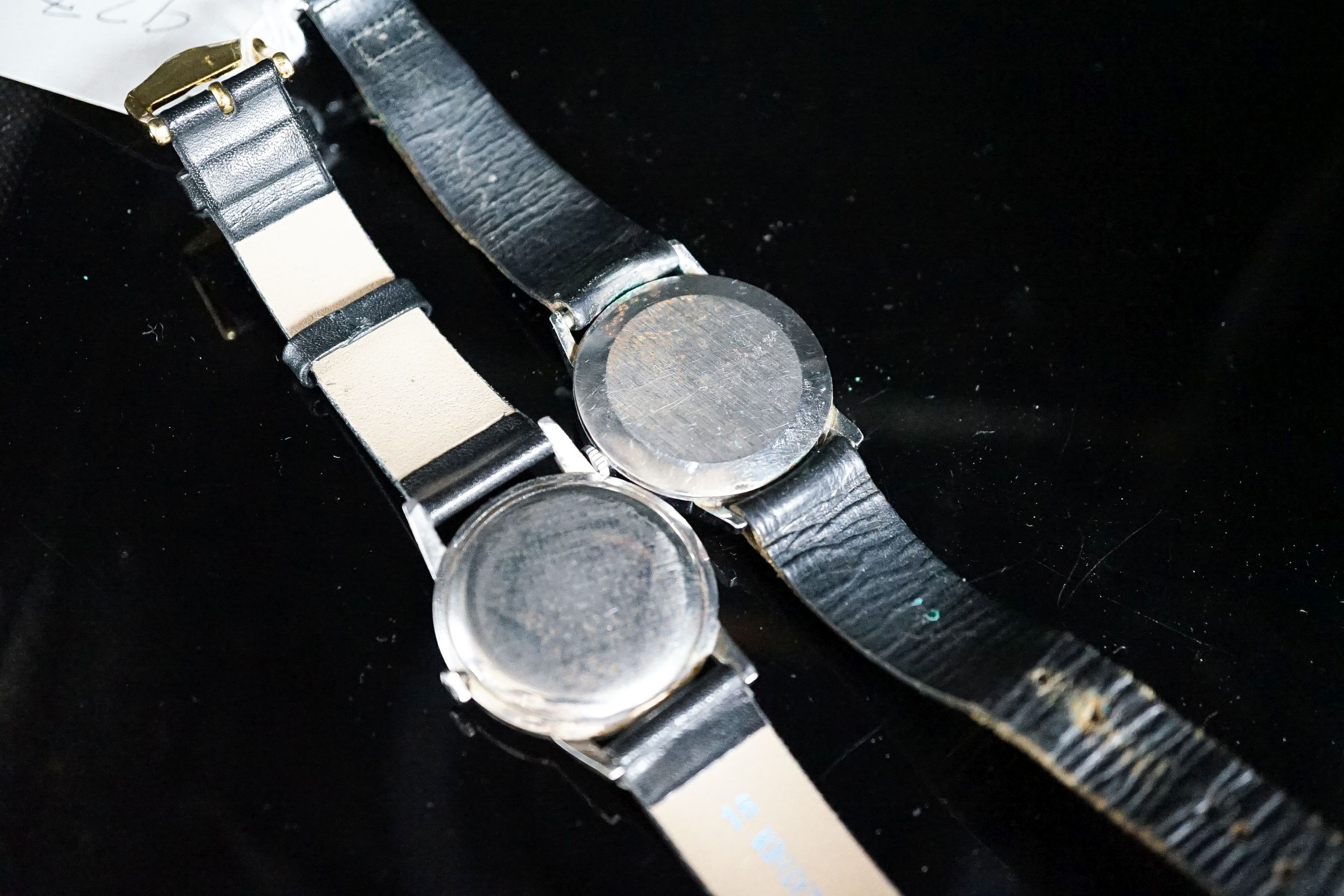 A gentleman's stainless steel Longines manual wind wrist watch, cased diameter 35mm and a similar Ingersol watch.